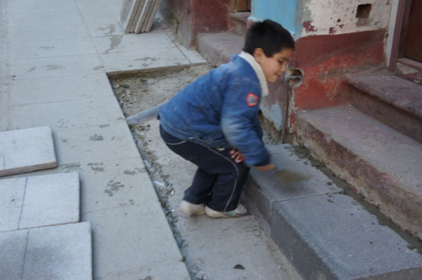 Child playing in street