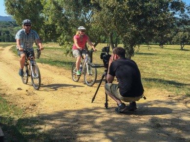 Dave and Deb cycling and filming