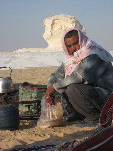 Our Guide cooking over open flame