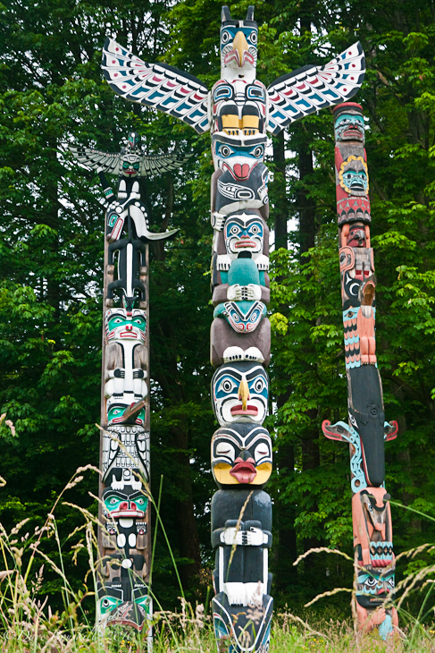 The Totem Poles rise with the trees in Stanley Park Vancouver