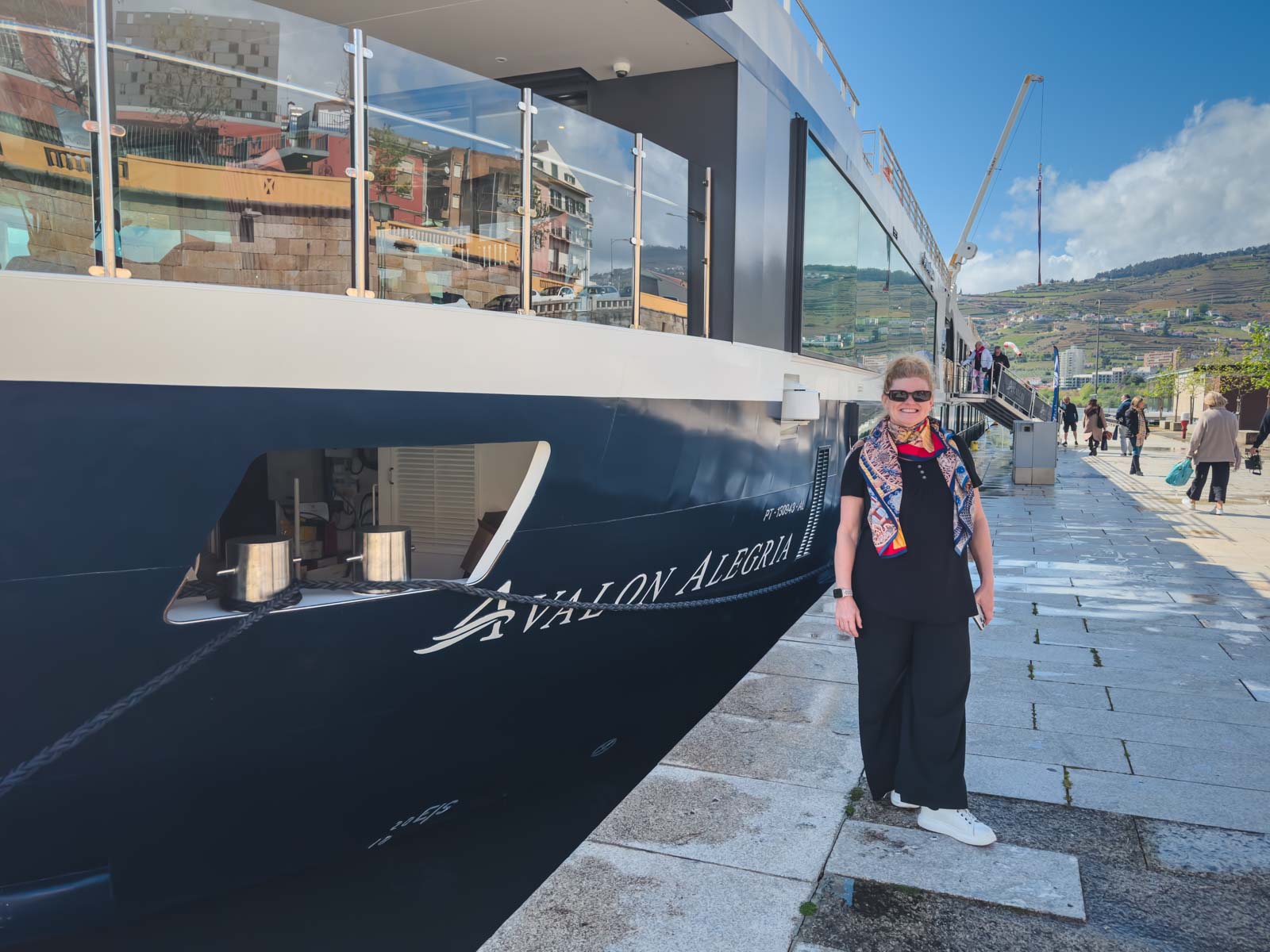Deb standing next to the Avalon Alegria in the Douro Valley