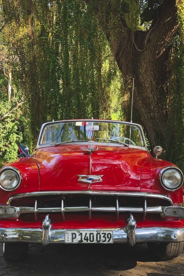 fun facts about cuba - classic red convertible in Havana Cuba