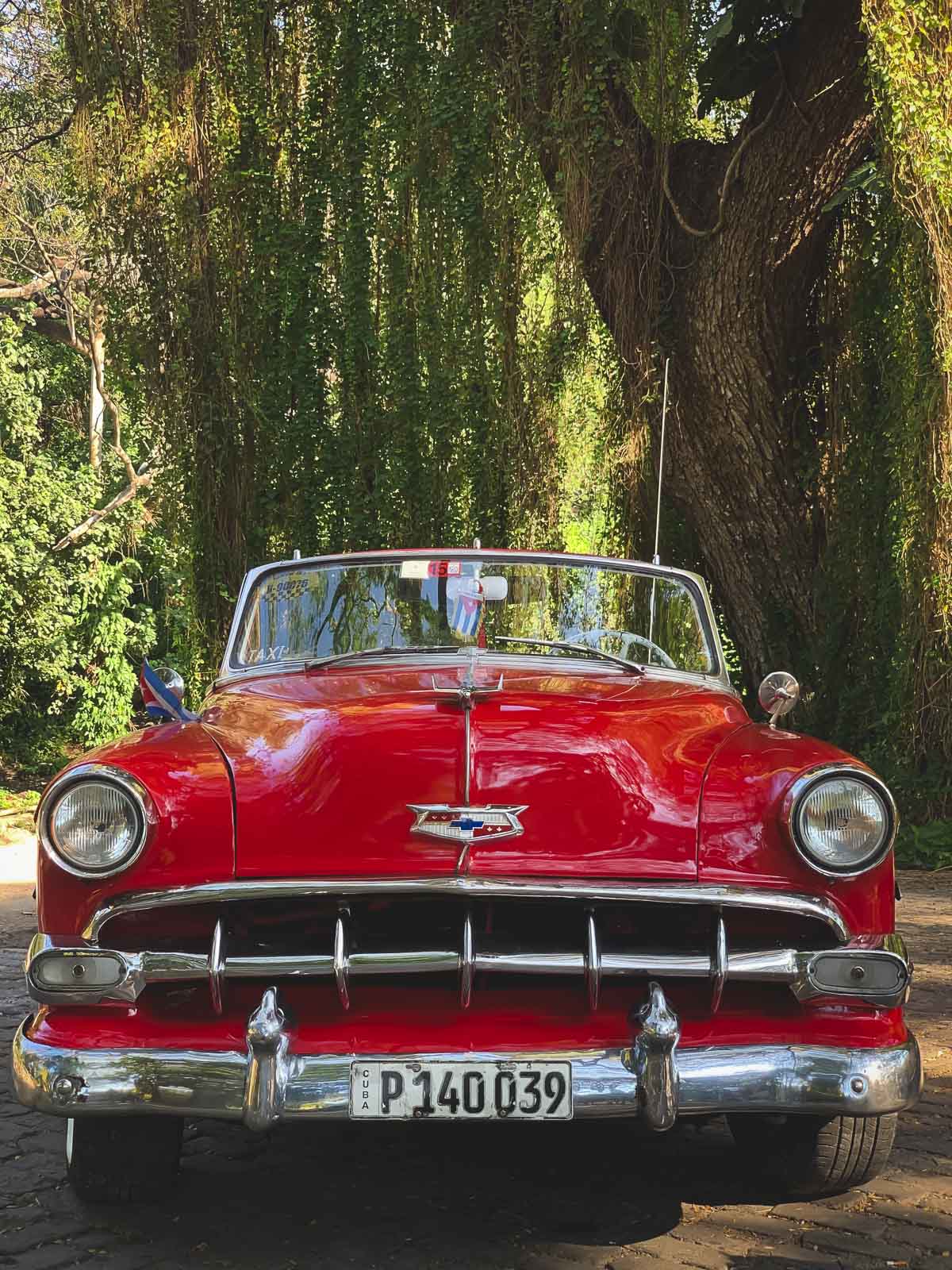 fun facts about cuba - classic red convertible in Havana Cuba