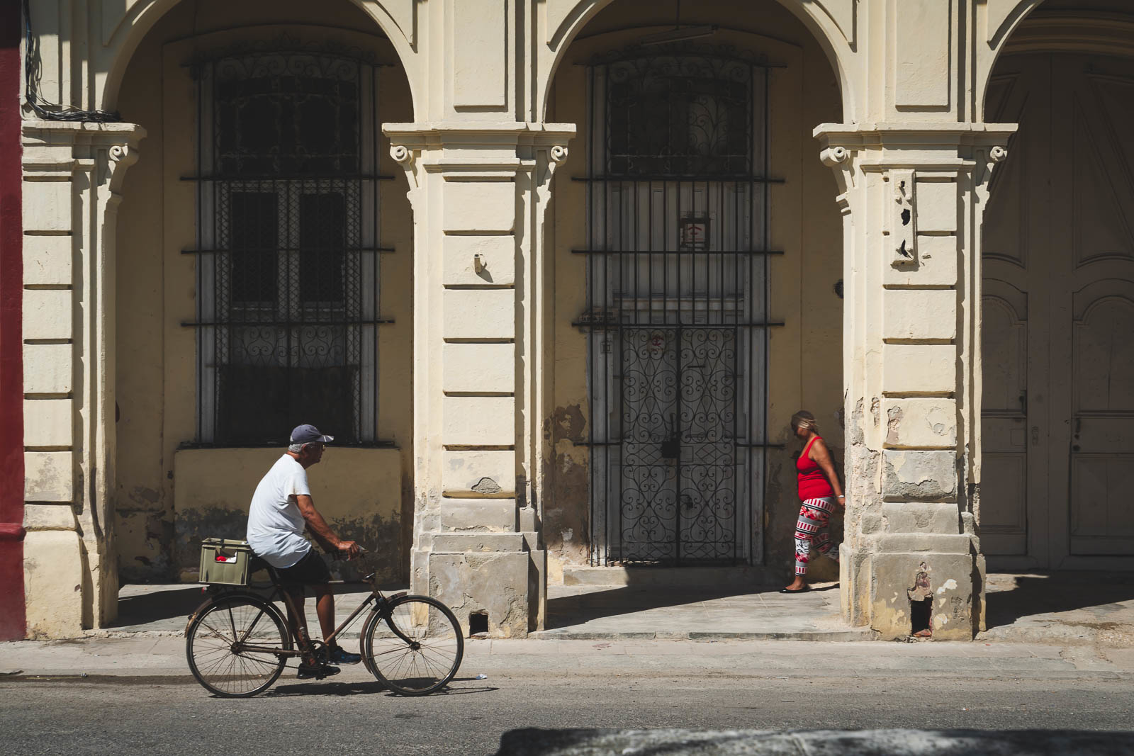 cuba facts - it's divers - a man riding his bicycle