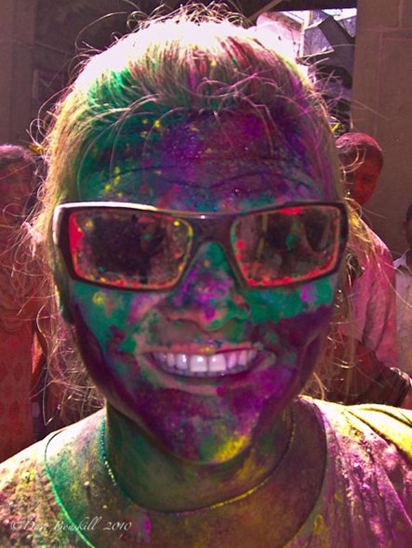 deb face covered in multiple colours at Holi Festival India