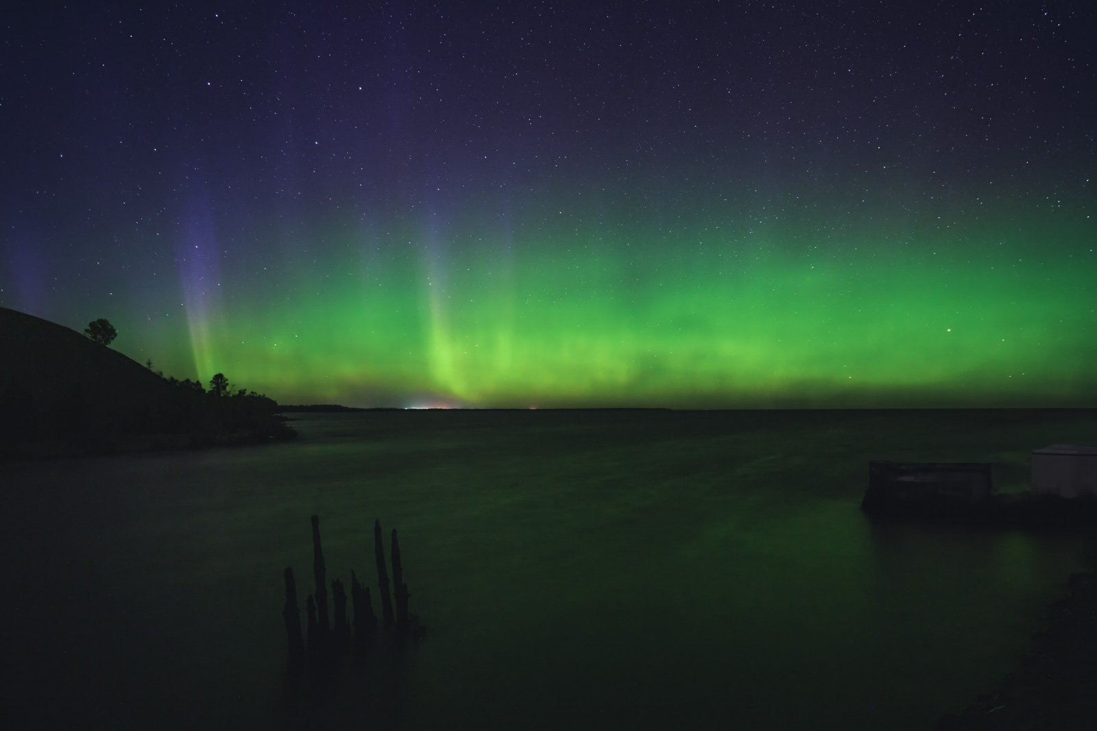 Aurora borealis and Full Moon over the Yukon River, Canada