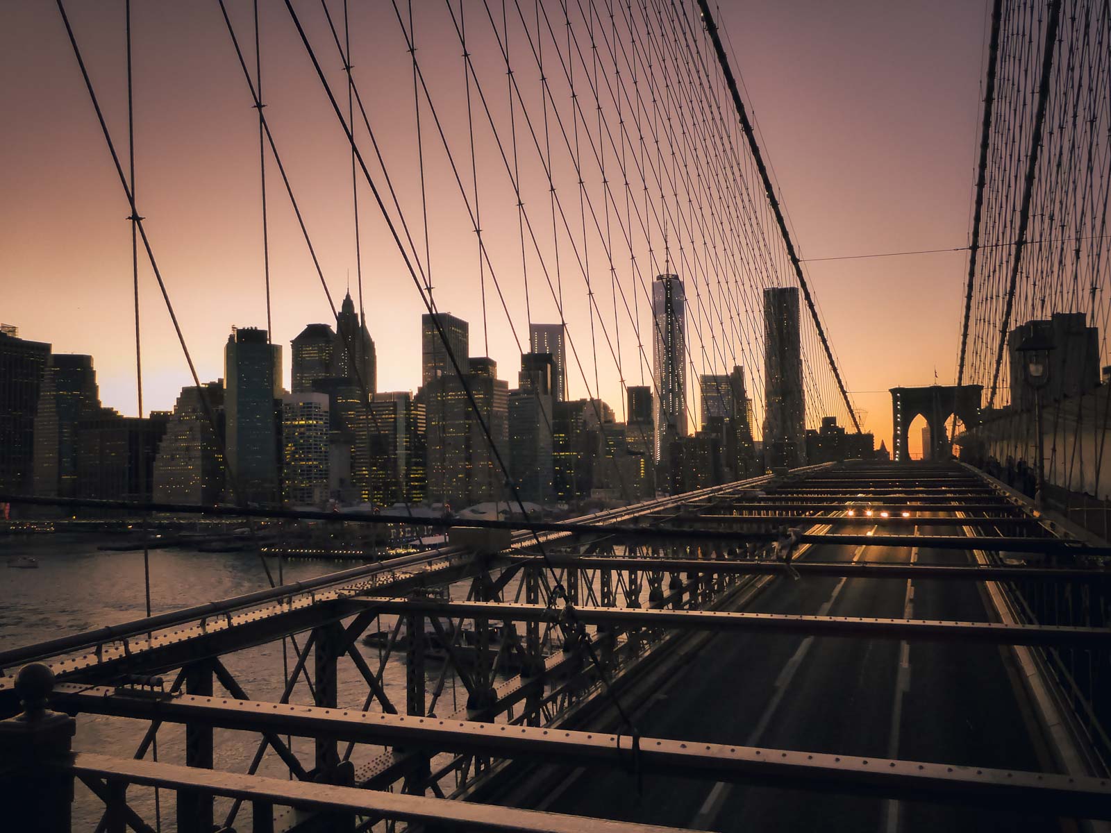 Crossing the Brooklyn Bridge at sunset