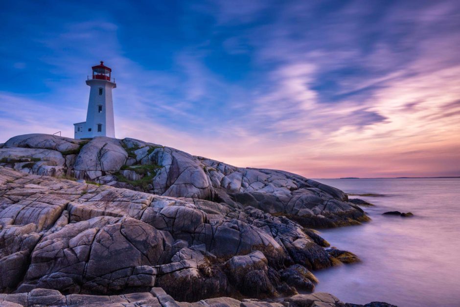 peggy's cove lighthouse at sunset in nova scotia
