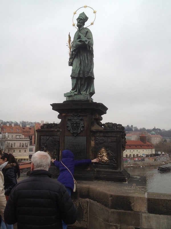 Prague sights to avoid - statue of St. John on Charles Bridge
