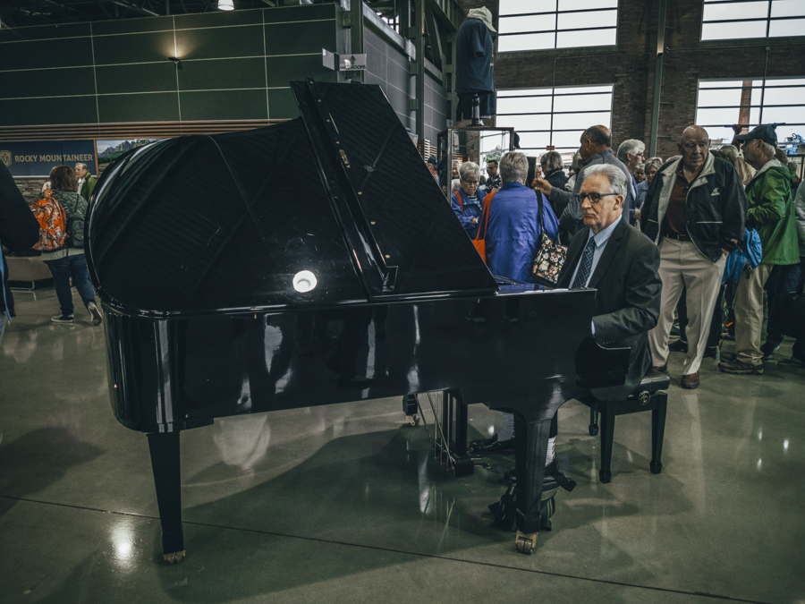 Piano Player at the rocky mountaineer train station.