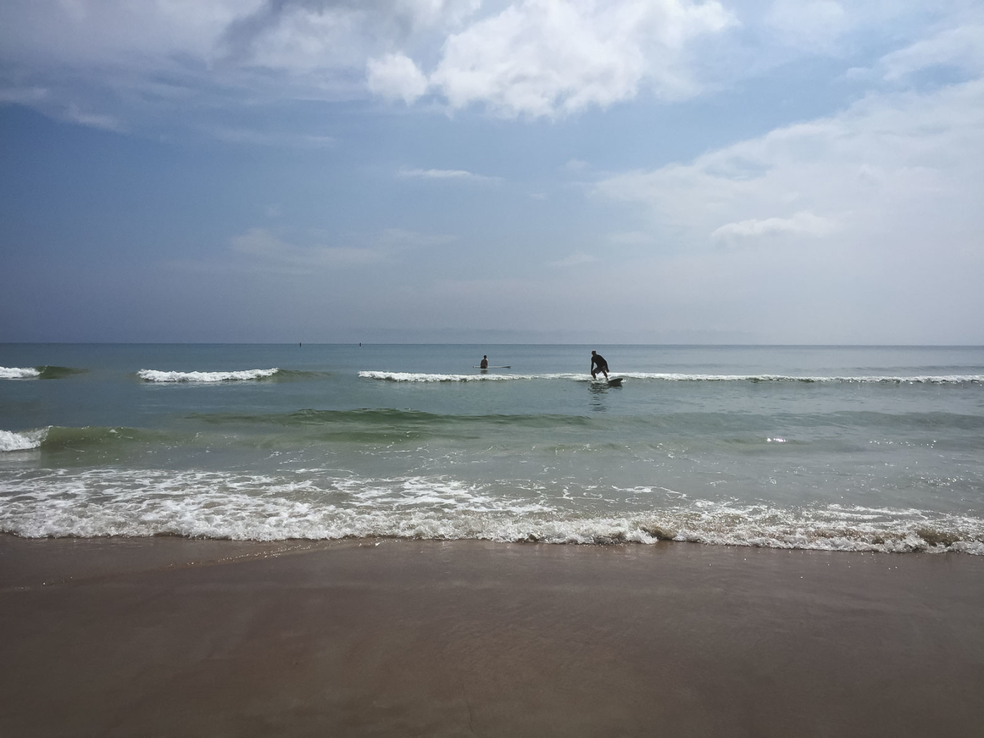 surfing the waves at Daytona Beach