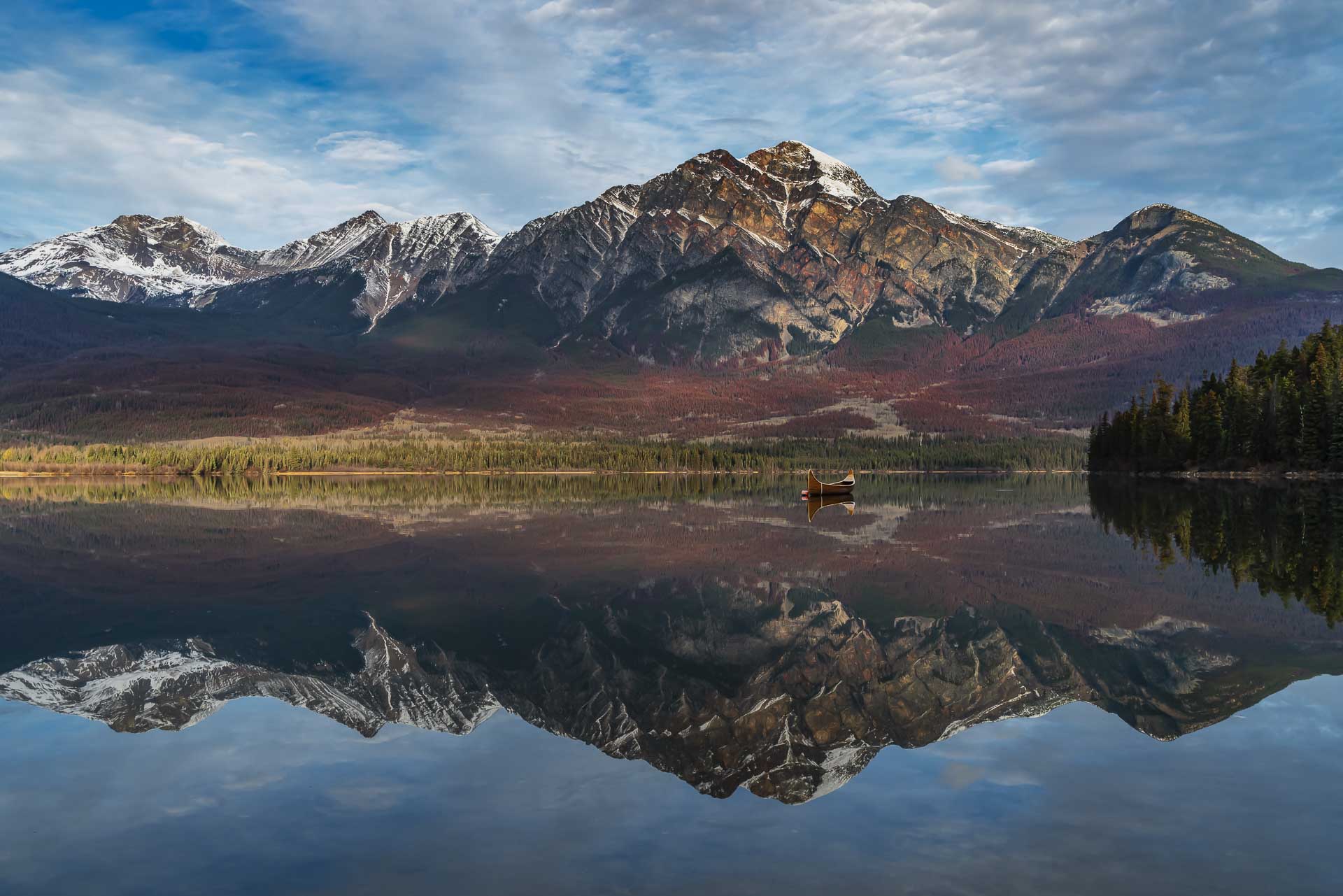 things to do in jasper reflection with canoe