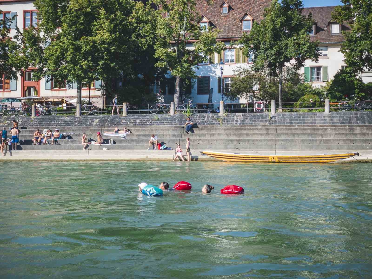 reasons to visit basel switzerland - swimming in the rhine river