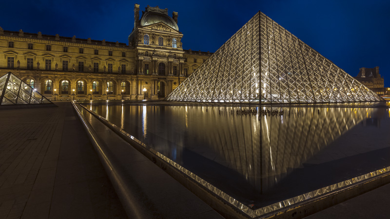louvre paris at night reflections