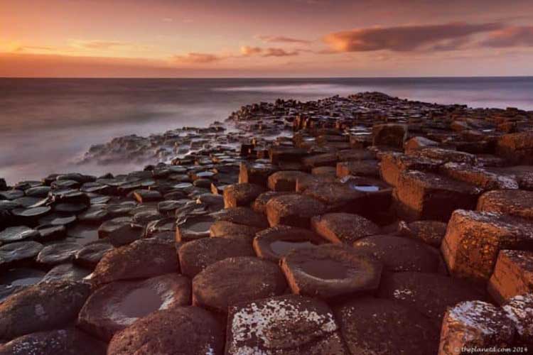 sunset at giants causeway in ireland