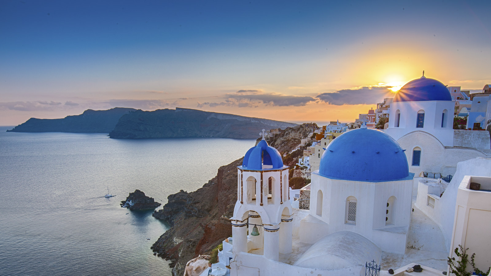 Sunset from the blue church domes is one of the best things to do in Santorini