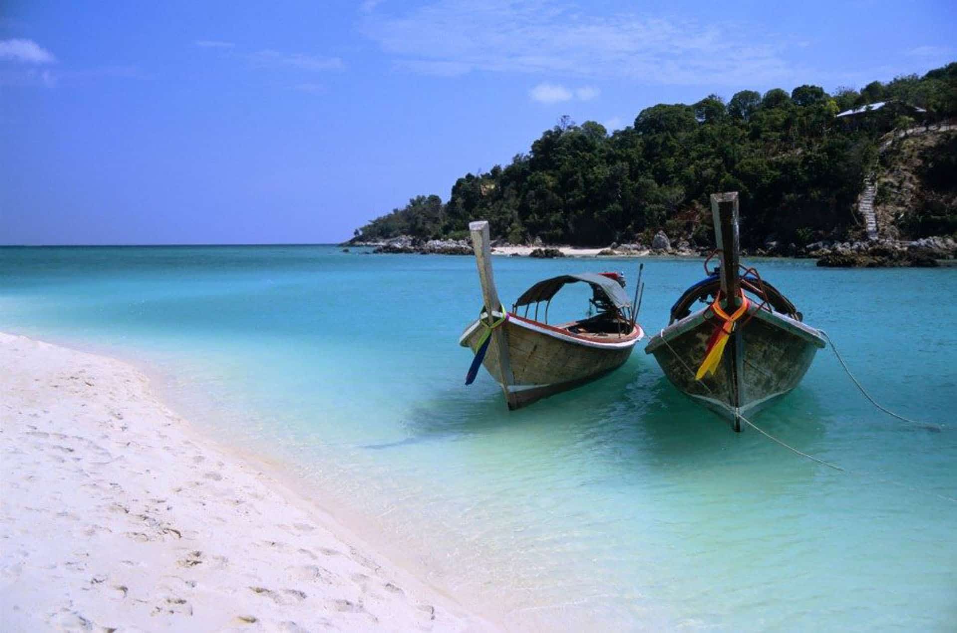 koh lipe thailand with two long tail boats