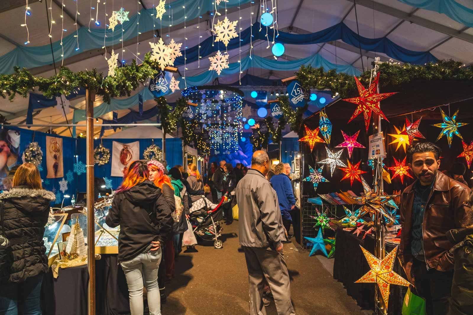 21 Best Places to Visit in December in the USA (2025 Edition) Shoppers browse the festive wooden stalls at the Christkindlmarkt in Bethlehem, Pennsylvania, known as Christmas City USA.