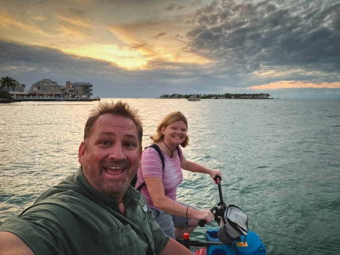 Dave and Deb of The Planet D on the ocean bike at sunset in Key West, Florida Keys