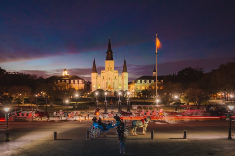 A horse carriage at Jackson Square in New Orleans, Louisiana at sunset
