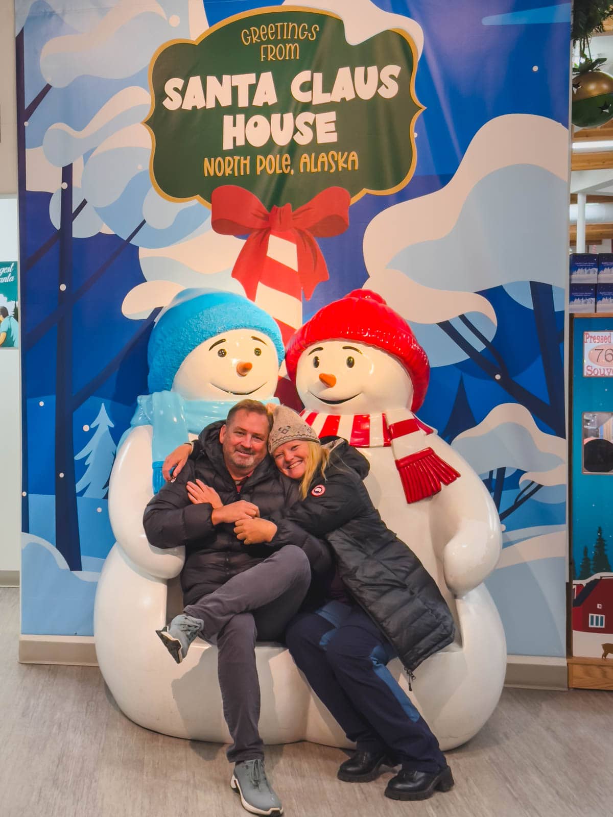 21 Best Places to Visit in December in the USA (2025 Edition) Dave and Deb at the festive Santa Claus House in North Pole, Alaska, one of the best places to visit in December.