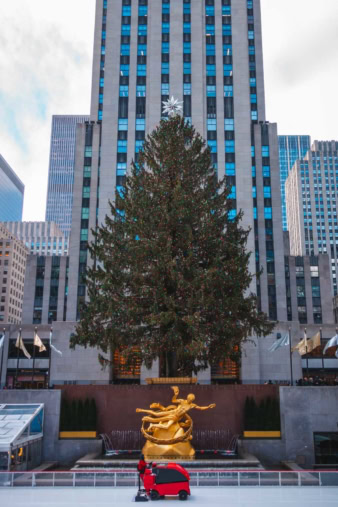 The iconic Rockefeller Center Christmas Tree lit up at night, one of the best places to visit in the US in December.