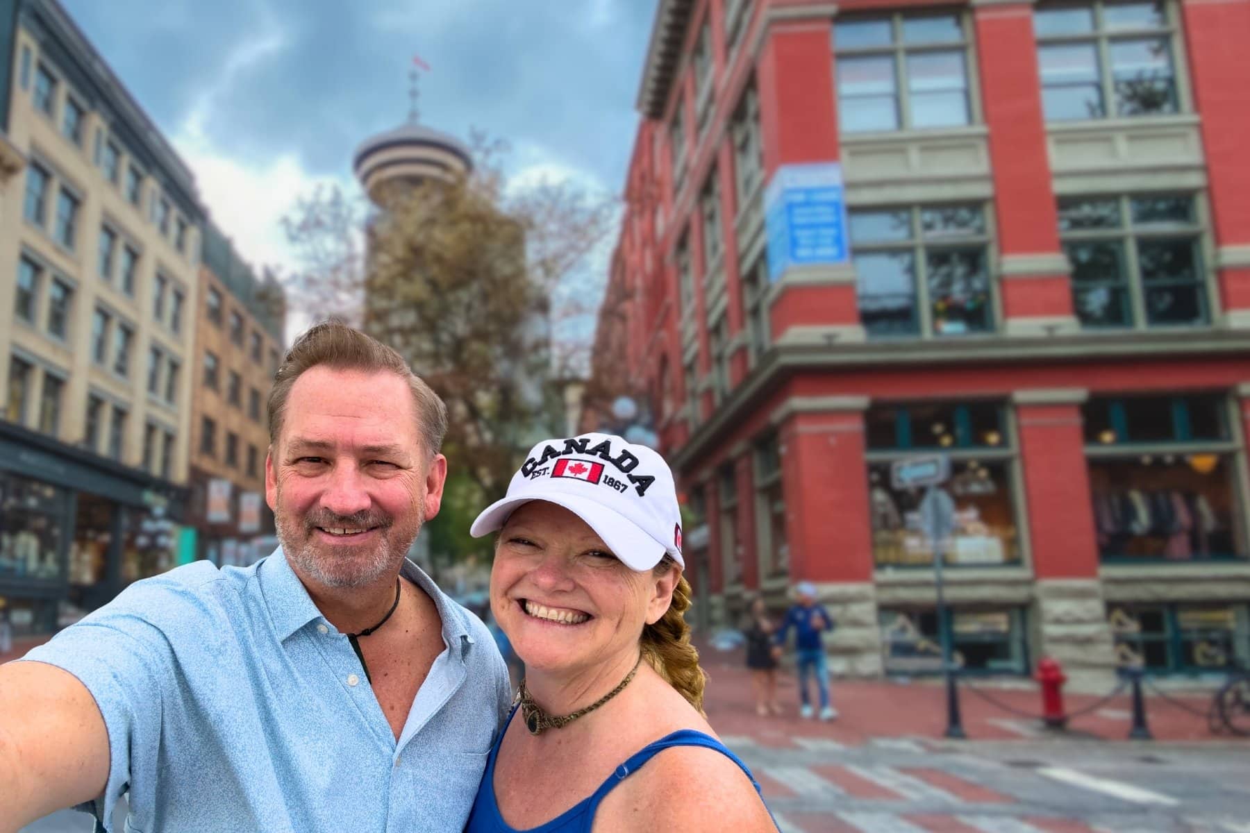 Dave and Deb of The Planet D smiling in front of Gastown