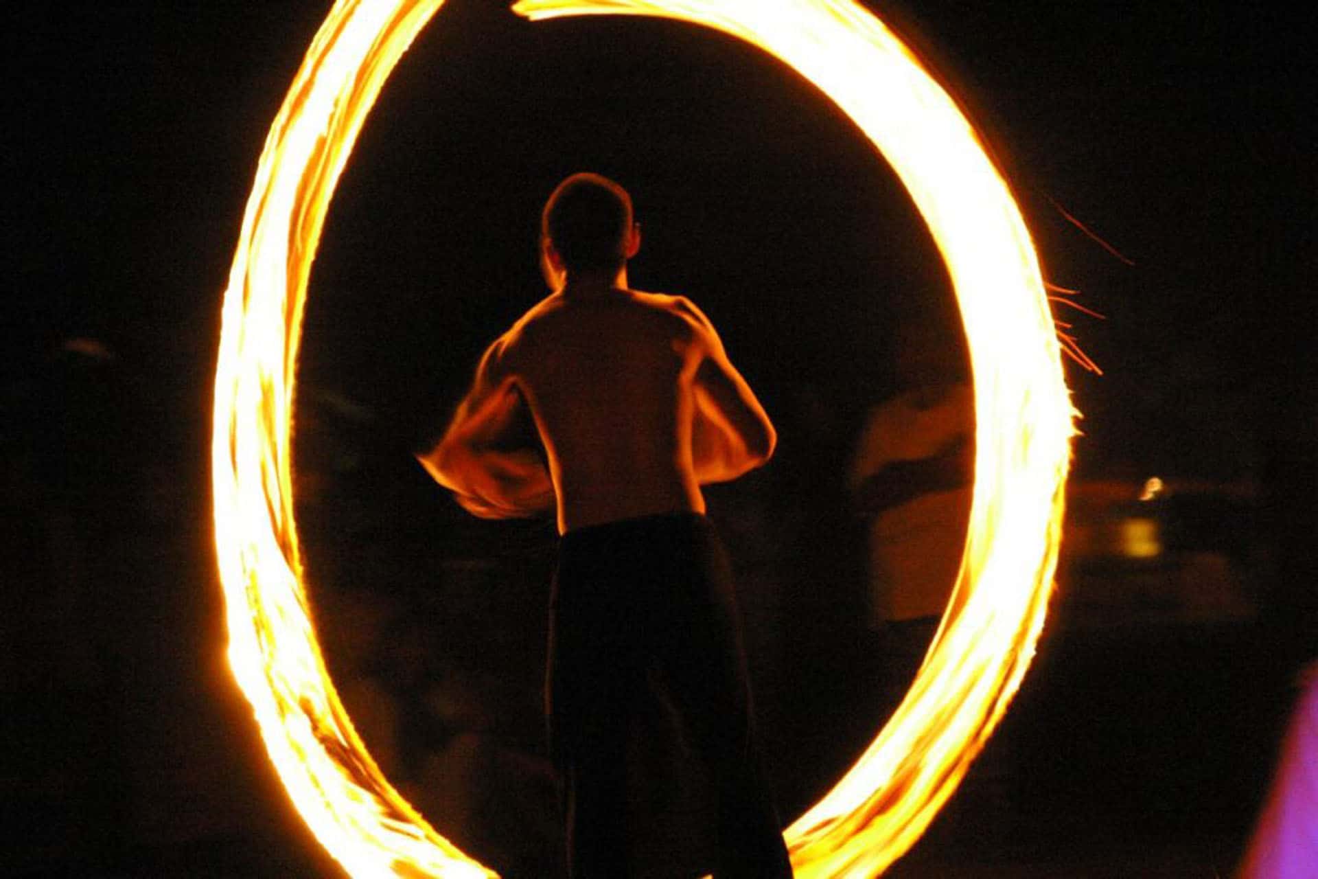 fire spinning is a popular nighttime activity on beaches in thailand