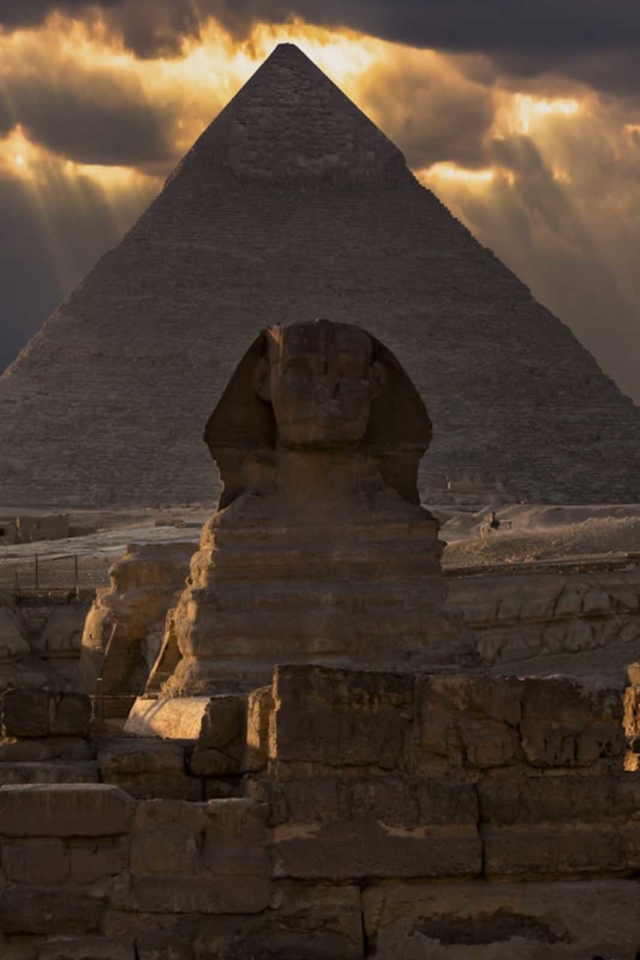 historical places great sphinx of Egypt stands in front of the Great Pyramid