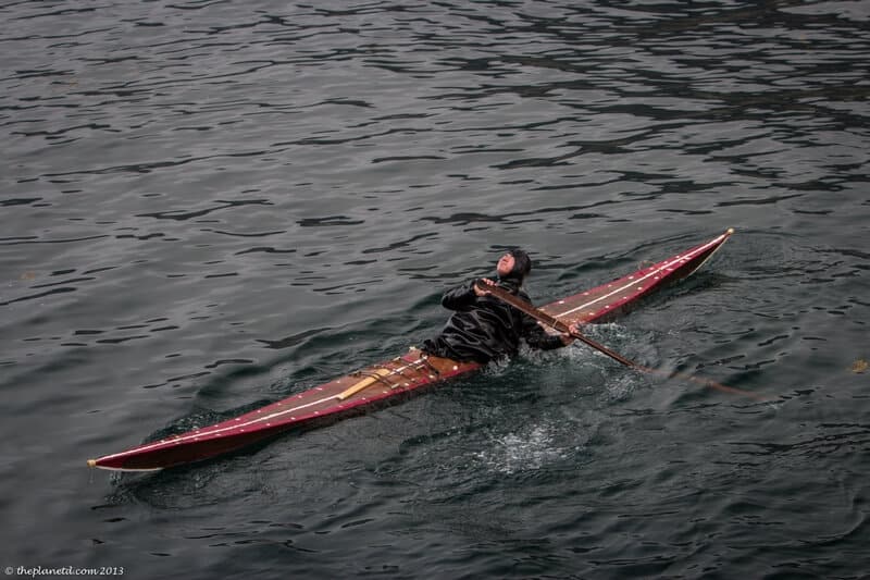kayaking in Greenland kayaker demonstrating his skills