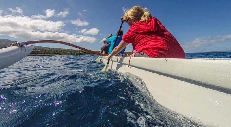 paddling an outrigger canoe