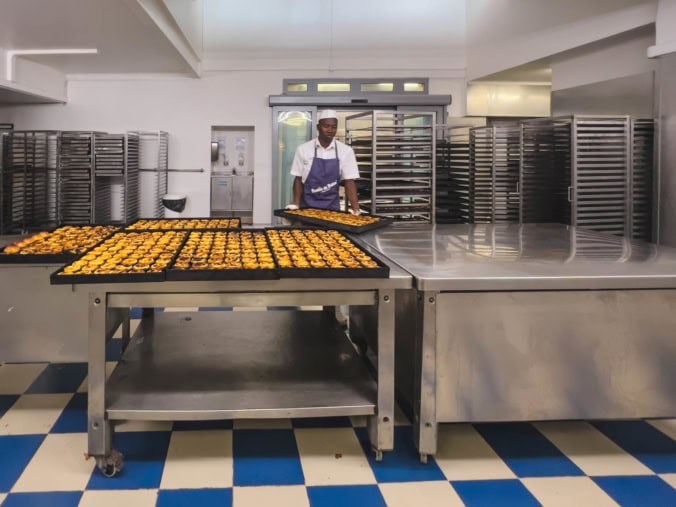 Baking the famous Pastel de Nata at Pasteies de Belem in Lisbon, Portugal