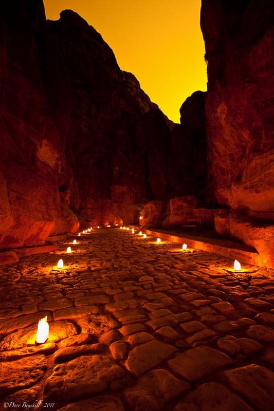 Petra is lit by candles at night