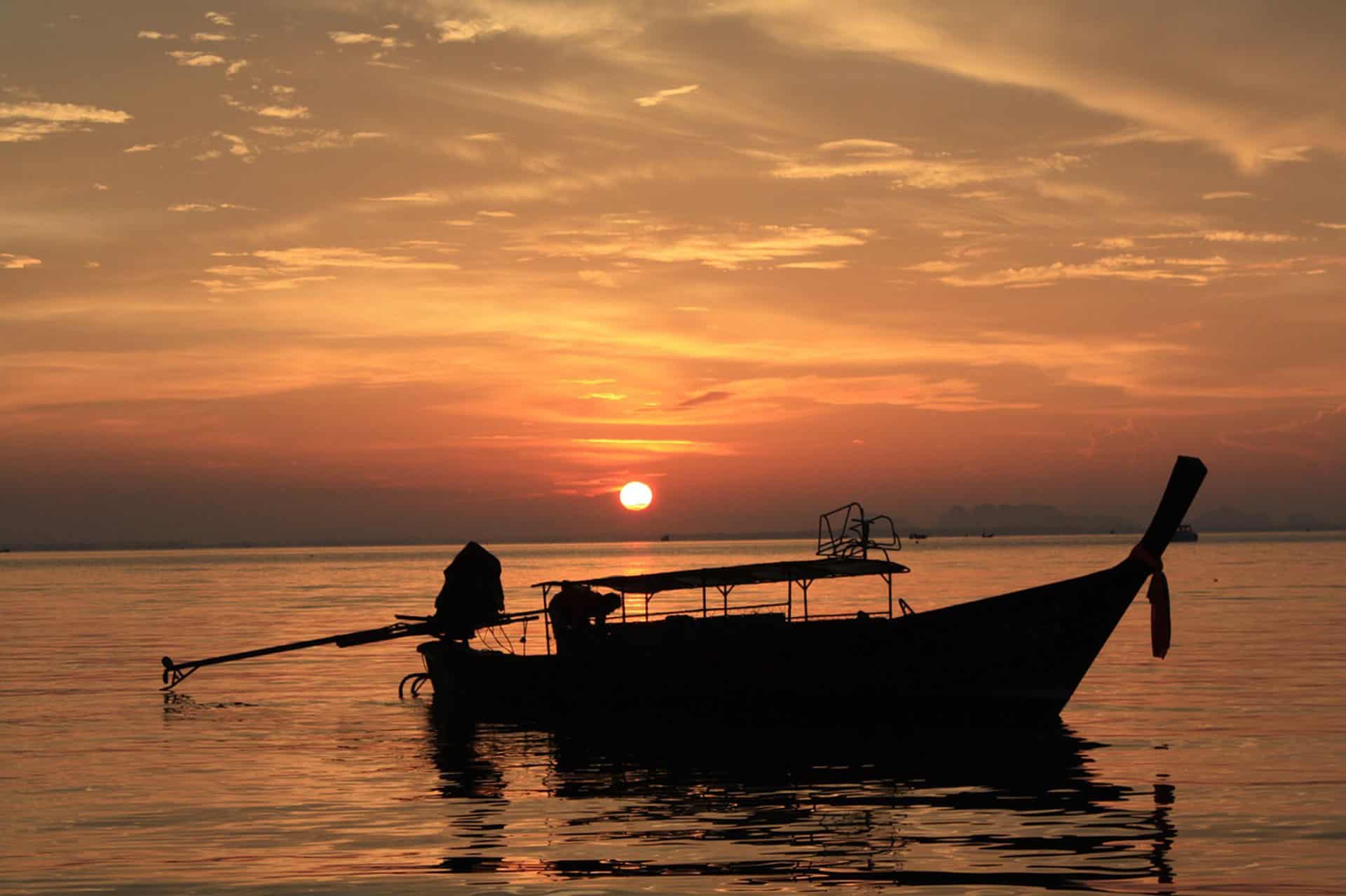 longtail boat at sunset ao nang beach