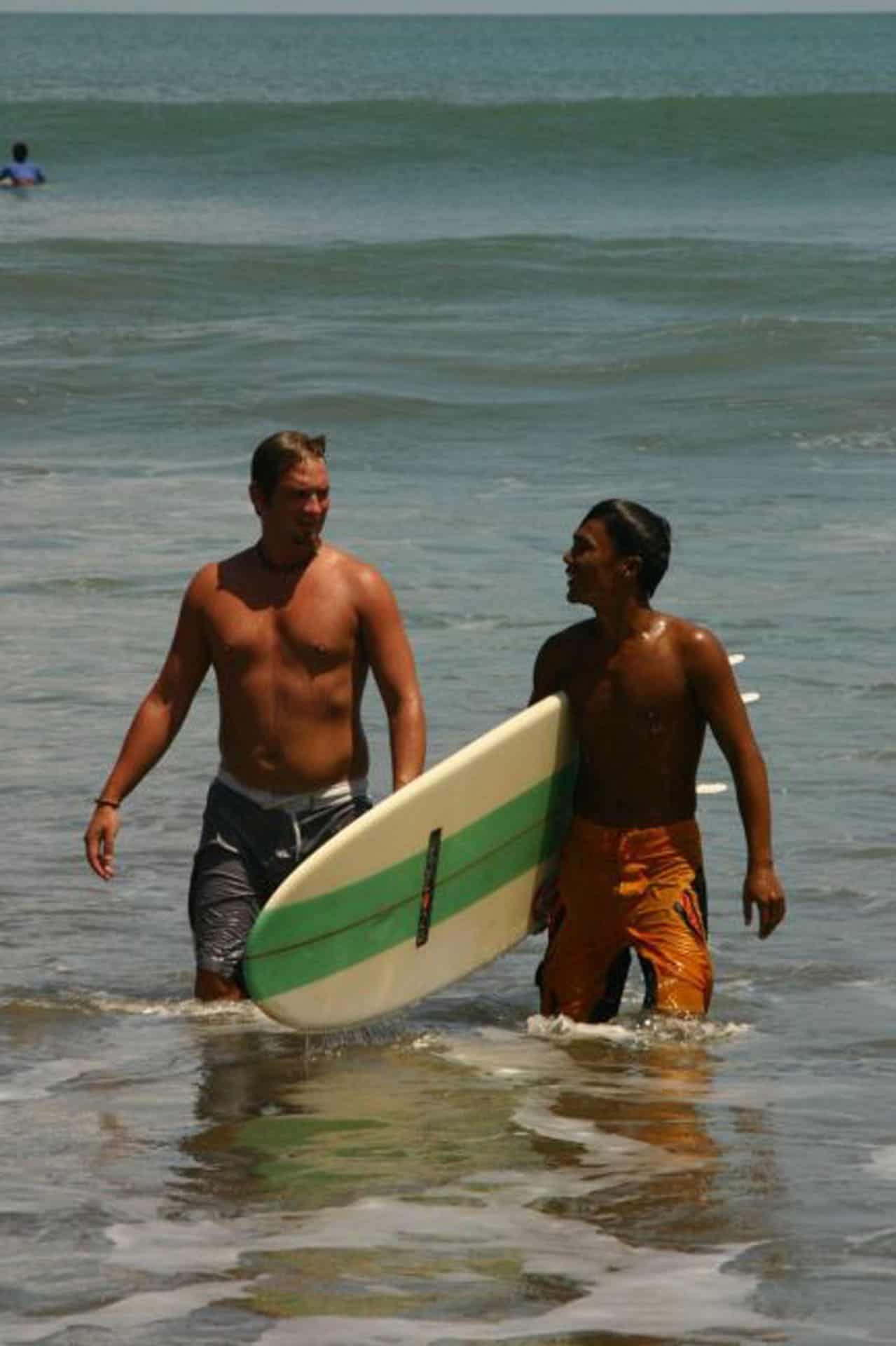 surfers at kuta beach