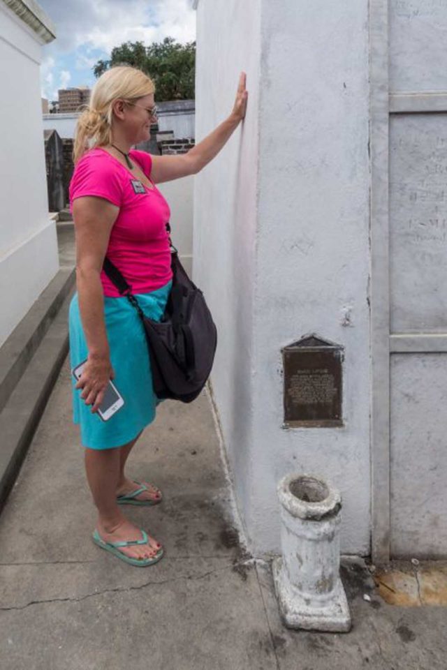 things to do in new orleans - deb making a wish at the tomb of Marie Laveau