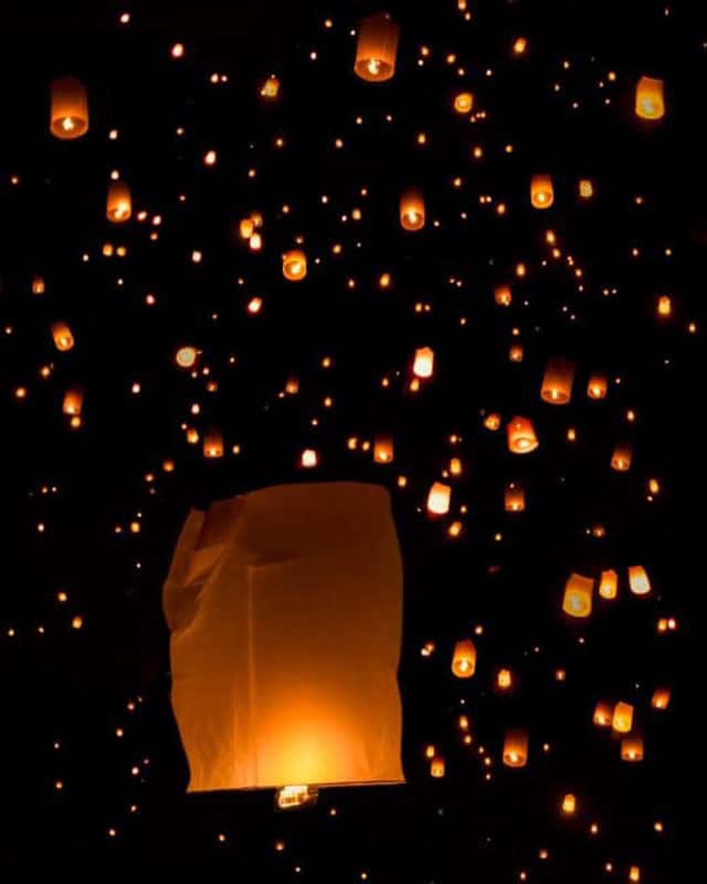 yi peng festival lanterns in sky thailand